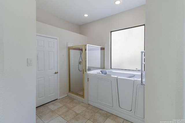 5919 Cedar Path, San Antonio, TX 78249 - laundry area with separate washer and dryer, light tile patterned flooring, and recessed lighting