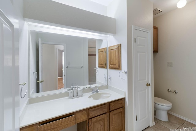 5919 Cedar Path, San Antonio, TX 78249 - bathroom featuring toilet, tile patterned floors, vanity, and baseboards