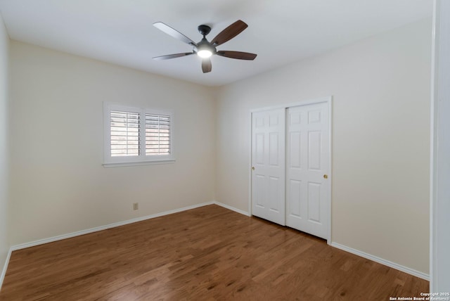 5919 Cedar Path, San Antonio, TX 78249 - unfurnished bedroom featuring wood finished floors, baseboards, and a closet