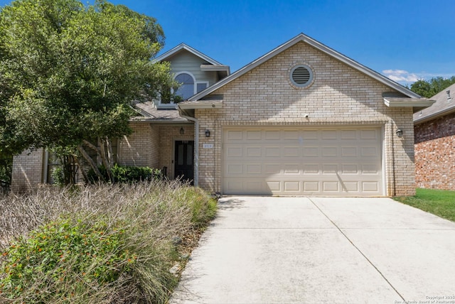 5919 Cedar Path, San Antonio, TX 78249 - view of front of property with brick siding, an attached garage, and concrete driveway
