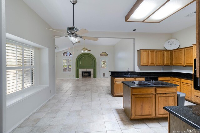 5919 Cedar Path, San Antonio, TX 78249 - kitchen featuring ceiling fan, a sink, a center island, vaulted ceiling, and light tile patterned floors