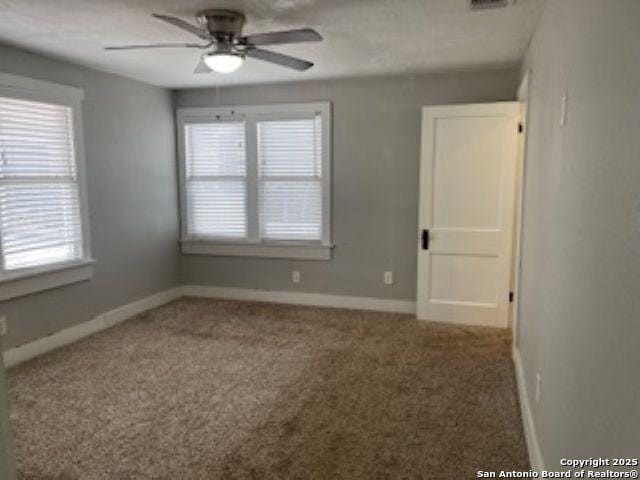 1239 Kayton, San Antonio, TX 78210 - carpeted empty room with a ceiling fan, healthy amount of natural light, and baseboards
