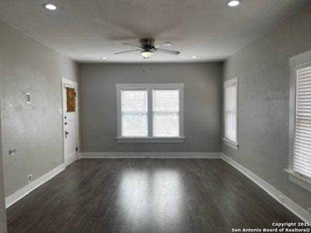 1239 Kayton, San Antonio, TX 78210 - unfurnished living room featuring ceiling fan, wood finished floors, baseboards, and recessed lighting