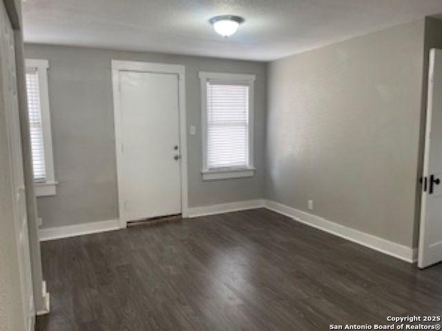 1239 Kayton, San Antonio, TX 78210 - foyer entrance featuring dark wood finished floors and baseboards
