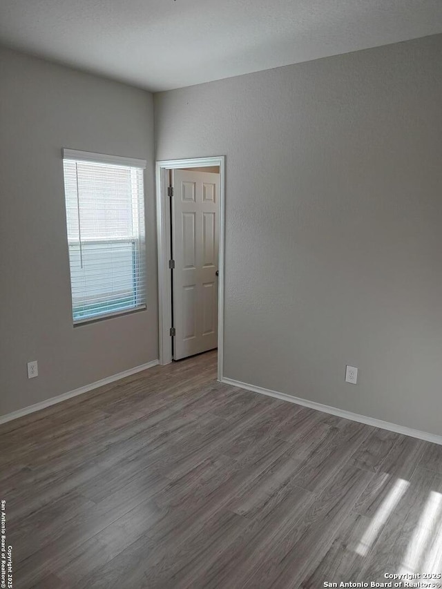 530 Pleasanton, San Antonio, TX 78221 - unfurnished room with wood finished floors and baseboards