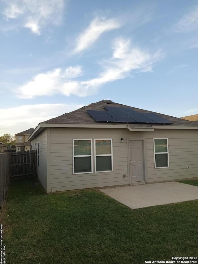 530 Pleasanton, San Antonio, TX 78221 - rear view of property featuring roof mounted solar panels and a patio