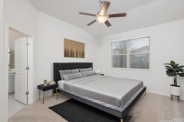 bedroom with vaulted ceiling, baseboards, light colored carpet, and ceiling fan