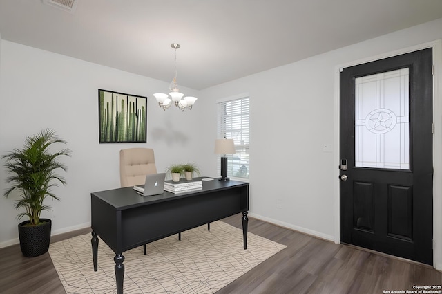 office area featuring wood finished floors, a chandelier, and baseboards