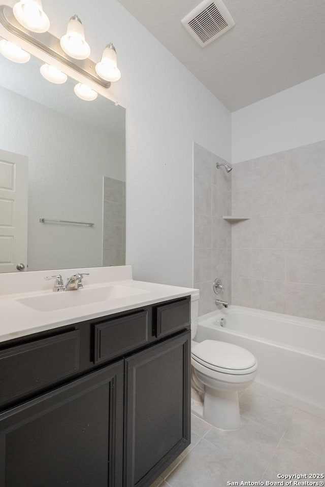 full bath featuring toilet, tub / shower combination, tile patterned floors, and vanity
