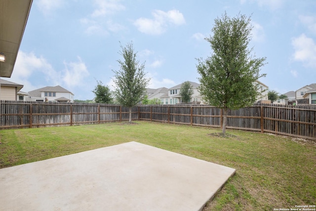 view of yard featuring a residential view and a patio