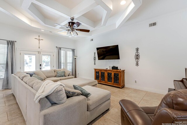 515 County Road 3822, San Antonio, TX 78253 - living area featuring a ceiling fan, coffered ceiling, beam ceiling, baseboards, and light tile patterned floors