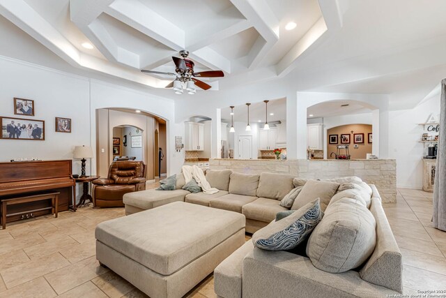 515 County Road 3822, San Antonio, TX 78253 - living area featuring arched walkways, ceiling fan, beamed ceiling, coffered ceiling, and a towering ceiling