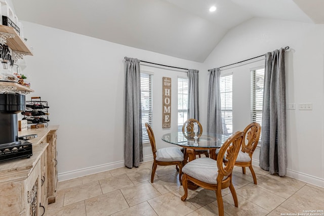 515 County Road 3822, San Antonio, TX 78253 - dining room featuring lofted ceiling, baseboards, light tile patterned floors, and a bar
