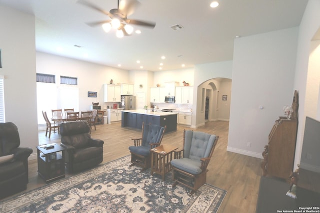 2965 Grove Way, Seguin, TX 78155 - living room with ceiling fan, arched walkways, wood finished floors, recessed lighting, and baseboards