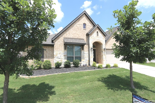 2965 Grove Way, Seguin, TX 78155 - view of front of property featuring stone siding, a front yard, brick siding, an attached garage, and driveway