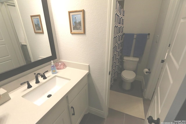 2965 Grove Way, Seguin, TX 78155 - full bathroom with toilet, tile patterned flooring, vanity, and a textured wall