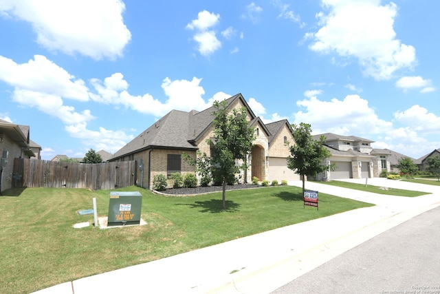 2965 Grove Way, Seguin, TX 78155 - french country inspired facade with brick siding, concrete driveway, a residential view, and an attached garage