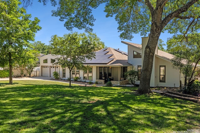 7214 N Vandiver, San Antonio, TX 78209 - view of front of property featuring an attached garage, roof mounted solar panels, concrete driveway, and a shingled roof
