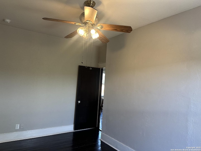 539 Wickes, San Antonio, TX 78210 - empty room with baseboards, dark wood-type flooring, a ceiling fan, and a smoke detector