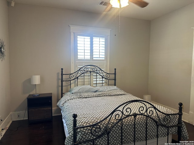 539 Wickes, San Antonio, TX 78210 - bedroom featuring baseboards and wood finished floors