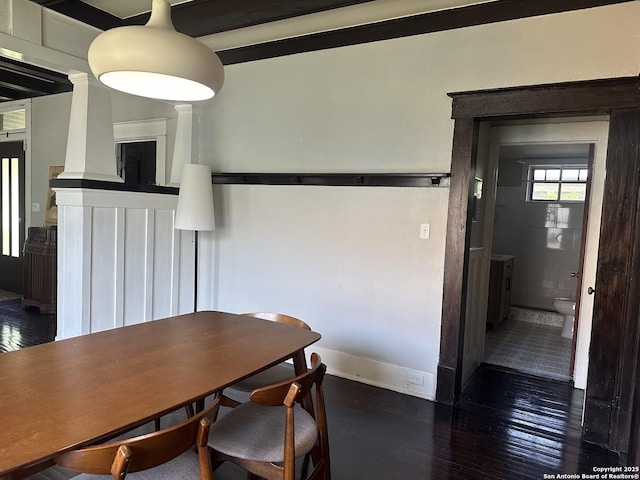 539 Wickes, San Antonio, TX 78210 - dining space featuring wood finished floors, baseboards, and decorative columns