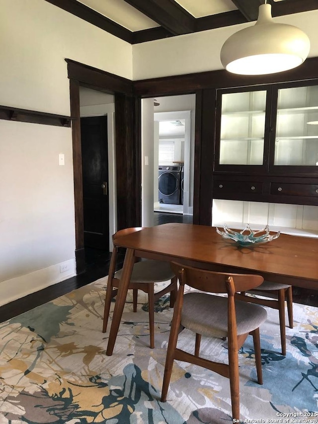 539 Wickes, San Antonio, TX 78210 - dining space featuring washer / clothes dryer, baseboards, and beam ceiling