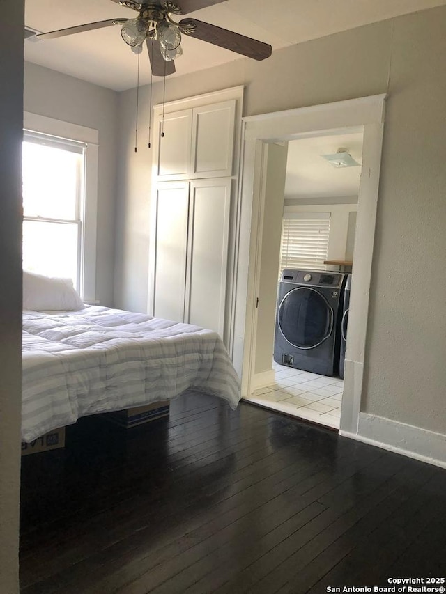 539 Wickes, San Antonio, TX 78210 - bedroom featuring independent washer and dryer, wood-type flooring, baseboards, ceiling fan, and a closet