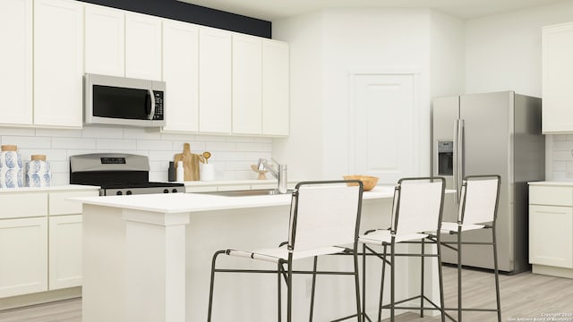 430 Kayden Ct, Marion, TX 78124 - kitchen with stainless steel appliances, a sink, backsplash, and light wood-type flooring