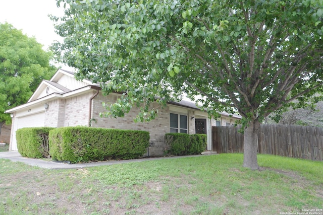 5759 Spring Watch, San Antonio, TX 78247 - view of front facade featuring brick siding and an attached garage