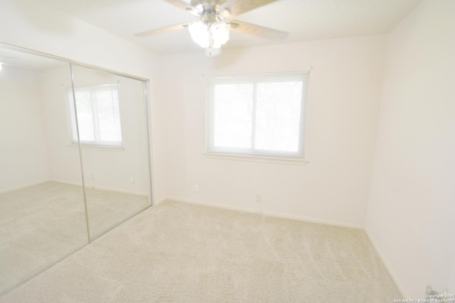 5759 Spring Watch, San Antonio, TX 78247 - unfurnished bedroom featuring carpet, a closet, a ceiling fan, and baseboards