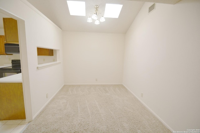 5759 Spring Watch, San Antonio, TX 78247 - empty room with a skylight, baseboards, light carpet, and a chandelier