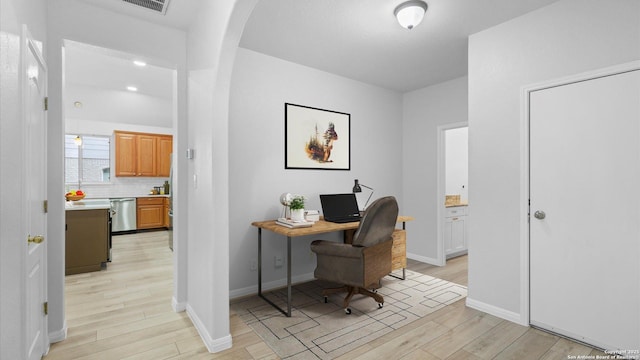 521 Faulkner, Schertz, TX 78154 - home office featuring light wood-style floors, arched walkways, and baseboards