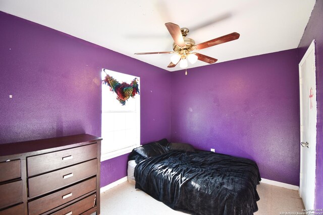 723 Clark Ave, San Antonio, TX 78210 - bedroom with baseboards and a ceiling fan