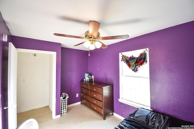 723 Clark Ave, San Antonio, TX 78210 - bedroom with baseboards, light colored carpet, and ceiling fan