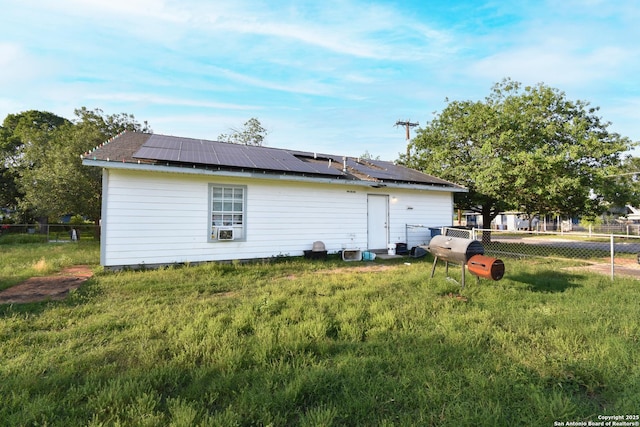 723 Clark Ave, San Antonio, TX 78210 - view of property exterior featuring roof mounted solar panels and cooling unit
