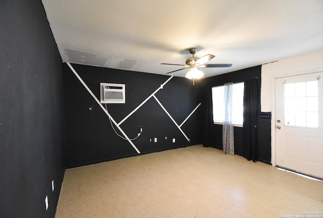 723 Clark Ave, San Antonio, TX 78210 - empty room with a wall unit AC and ceiling fan