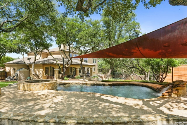 927 Scenic Stroll, San Antonio, TX 78260 - view of swimming pool featuring a patio, fence, and a pool with connected hot tub