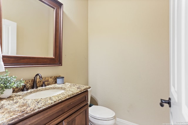 927 Scenic Stroll, San Antonio, TX 78260 - bathroom featuring vanity, toilet, and baseboards