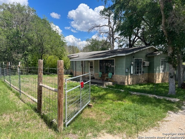 1379 Cedar Elm, New Braunfels, TX 78132 - view of front of house with a wall unit AC