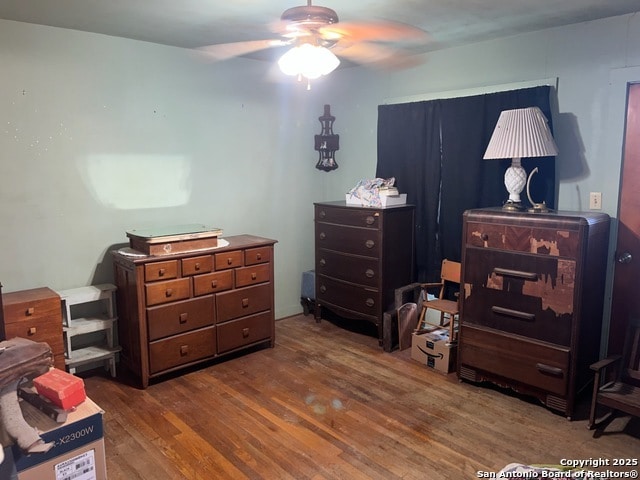 1379 Cedar Elm, New Braunfels, TX 78132 - bedroom featuring wood finished floors and ceiling fan