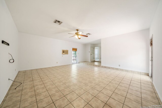 12138 W Lemon Blossom, San Antonio, TX 78247 - unfurnished room featuring a ceiling fan, light tile patterned flooring, and an AC wall unit
