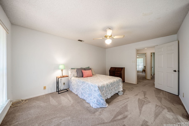12138 W Lemon Blossom, San Antonio, TX 78247 - bedroom with light colored carpet, a textured ceiling, ceiling fan, and a closet