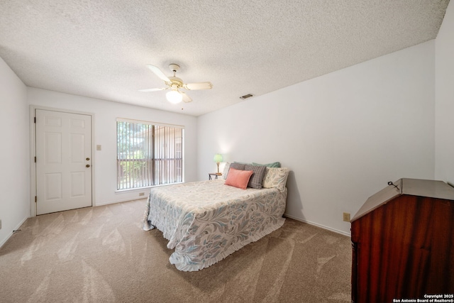 12138 W Lemon Blossom, San Antonio, TX 78247 - carpeted bedroom featuring a textured ceiling, a ceiling fan, and baseboards