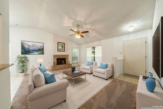 12138 W Lemon Blossom, San Antonio, TX 78247 - living area featuring light tile patterned flooring, lofted ceiling, ceiling fan, and a fireplace