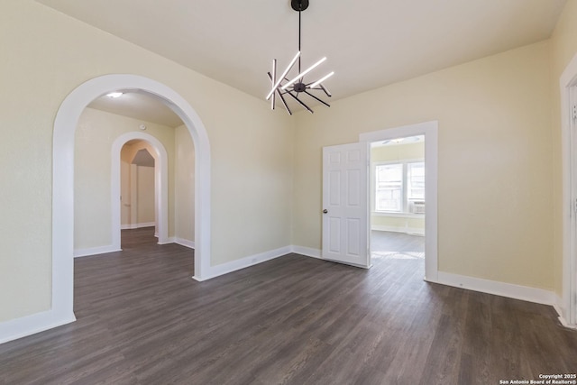 110 Muth, San Antonio, TX 78208 - unfurnished dining area with a chandelier, dark wood-type flooring, and baseboards