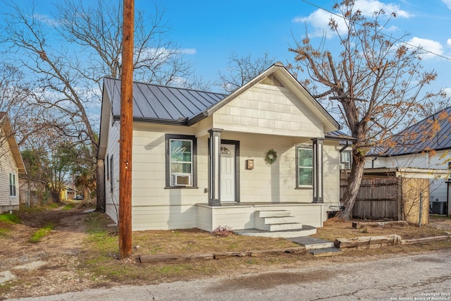 110 Muth, San Antonio, TX 78208 - bungalow with a standing seam roof, metal roof, covered porch, fence, and central AC