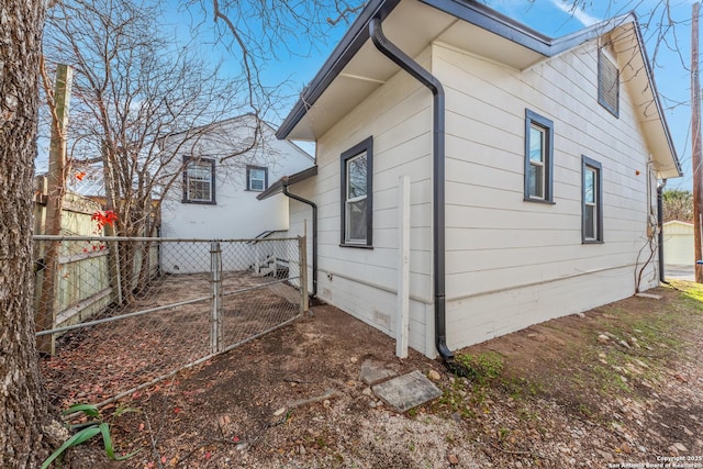 110 Muth, San Antonio, TX 78208 - view of side of home with fence and a gate