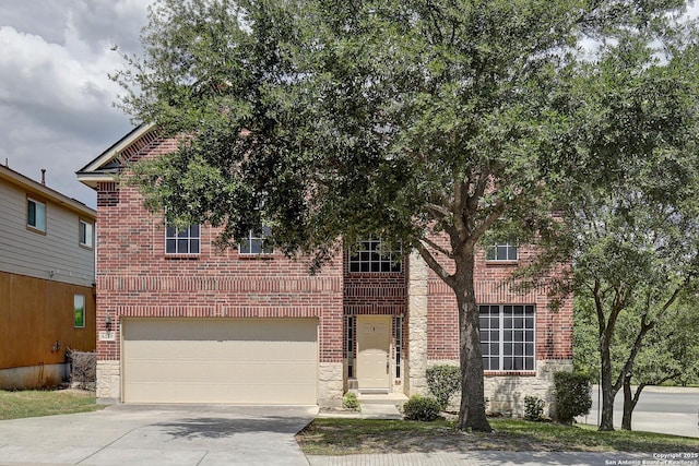 6139 Diego Ln, San Antonio, TX 78253 - view of front of property with driveway, brick siding, an attached garage, and stone siding