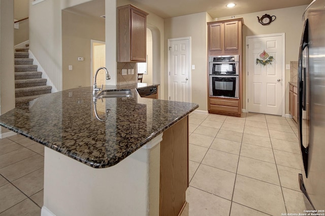6139 Diego Ln, San Antonio, TX 78253 - kitchen with a sink, stainless steel double oven, a peninsula, light tile patterned floors, and recessed lighting