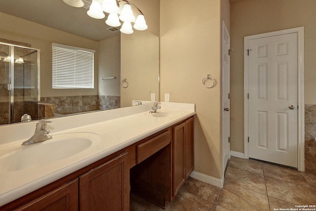 6139 Diego Ln, San Antonio, TX 78253 - bathroom with a shower stall, double vanity, a chandelier, and tile patterned floors